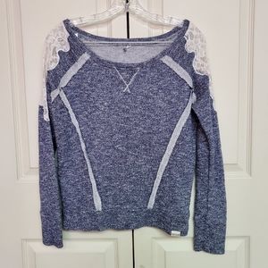 Ripcurl navy sweatshirt with lace on shoulders